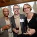 Mark Brown, Daniel Brown and Roberta Niedson pose for a photograph during the appetizer hour at Dining for Dollars fundraiser for HARC at Zingerman's Roadhouse on Wednesday.  Melanie Maxwell I AnnArbor.com